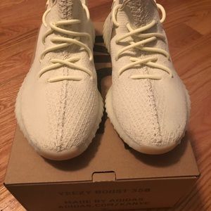 A pair of size 11.5 butter yeezys